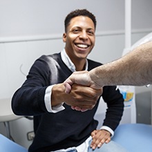 man shaking dentist's hand