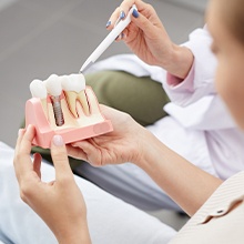 Plastic mockup of dental implant