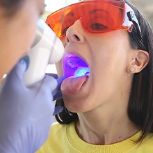 woman getting oral cancer screening