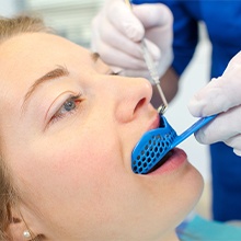 woman getting fluoride treatment